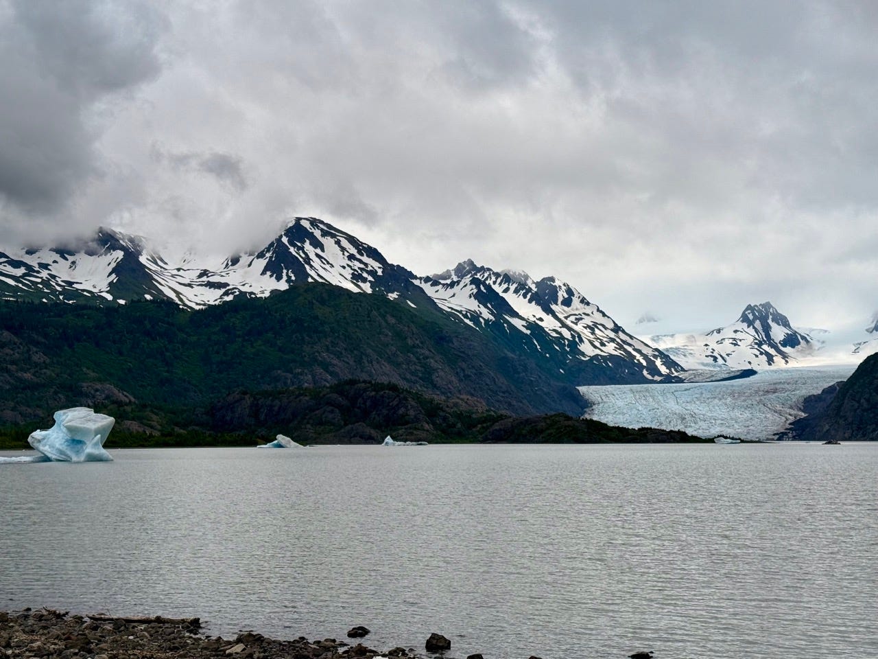 View of glaciers, snow-capped mountains on lake