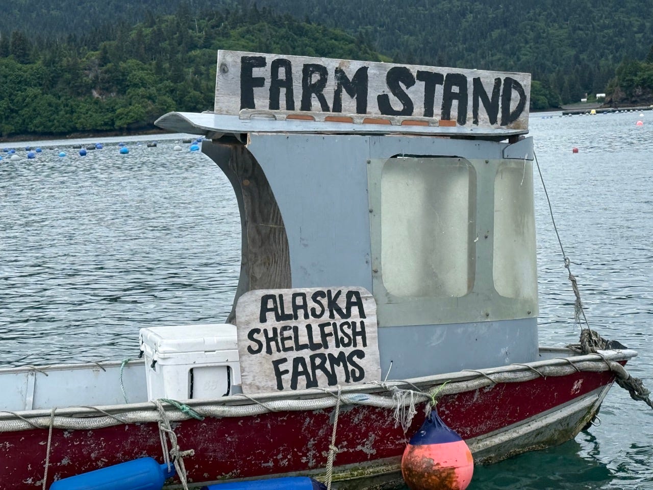 Alaska Shellfish farms farm stand signs on boat in water