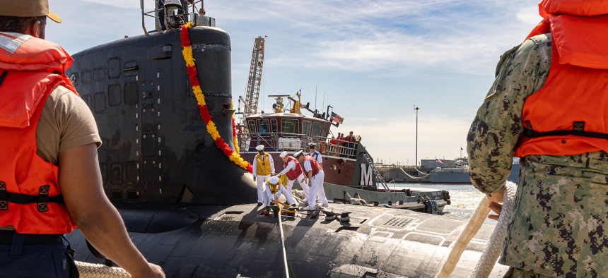 Sailors assigned to the Virginia-class fast-attack submarine USS New Mexico conduct mooring operations at Naval Station Norfolk, Sept. 22, 2025.