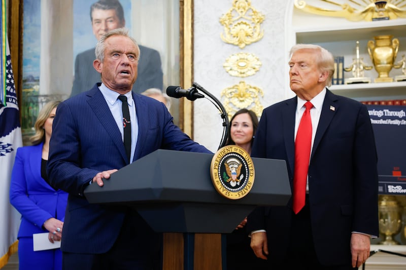 WASHINGTON, DC - OCTOBER 16: Secretary of Health and Human Services Robert F. Kennedy Jr. delivers remarks as U.S. President Donald Trump looks on during an event in the Oval Office of the White House on October 16, 2025 in Washington, DC. U.S. President Donald Trump outlined plans  during the event to expand vitro fertilization (IVF) access by encouraging workplace benefits to include access to IVF and infertility coverage. (Photo by Kevin Dietsch/Getty Images)