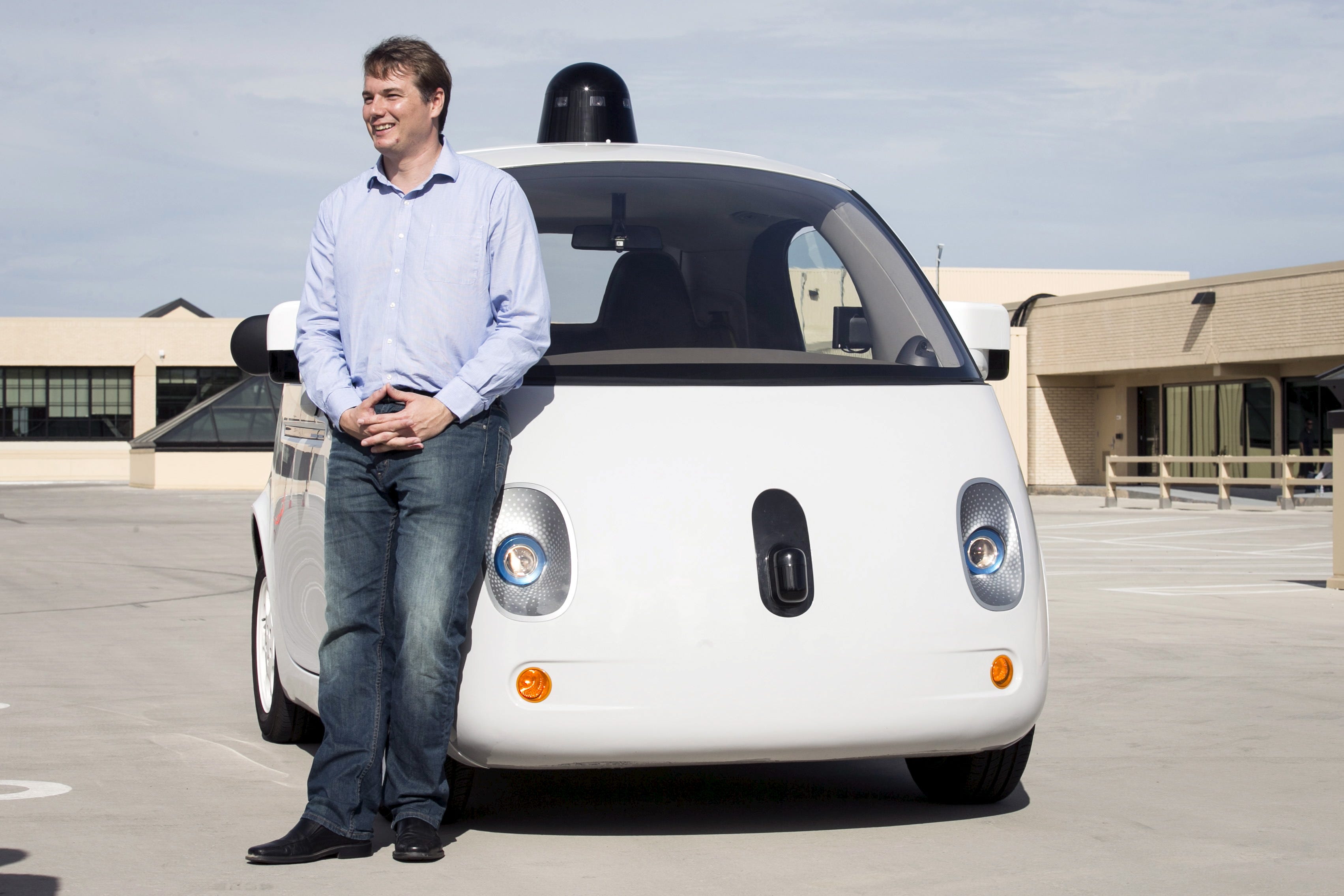 Chris Urmson, Director of the Self Driving Cars Project at Google, poses for photos in front of a prototype self-driving car during a media preview of Google's prototype autonomous vehicles in Moutain View, California September 29, 2015.