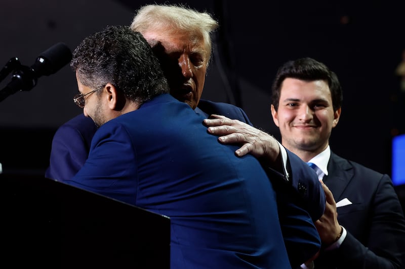 GRAND RAPIDS, MICHIGAN - NOVEMBER 05: Republican presidential nominee, former U.S. President Donald Trump, embraces Hamtramck, Michigan, Mayor Amer Ghalib during Trump's final campaign rally of the election year at Van Andel Arena on November 05, 2024 in Grand Rapids, Michigan. Trump campaigned for re-election in the battleground states of North Carolina and Pennsylvania before arriving for his last rally minutes after midnight in Michigan. (Photo by Chip Somodevilla/Getty Images)