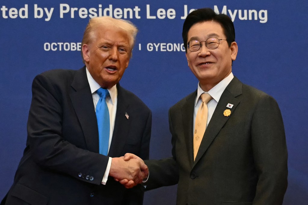 President Lee Jae Myung and US President Donald Trump shaking hands.