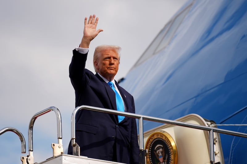 President Donald Trump boards Air Force One as he prepares to depart for South Korea at Haneda Airport on October 29, 2025 in Tokyo, Japan.