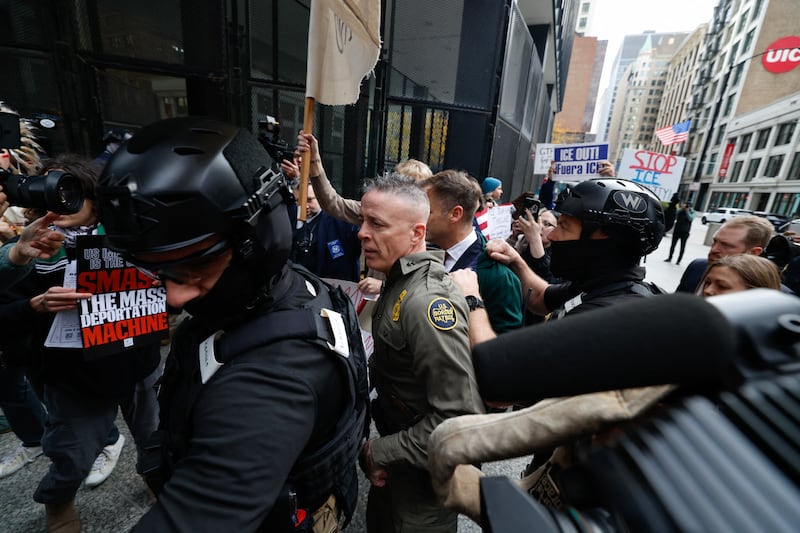 US Customs and Border Patrol Commander Gregory Bovino (C) arrives to federal court at Dirksen Federal Building in Chicago, Illinois