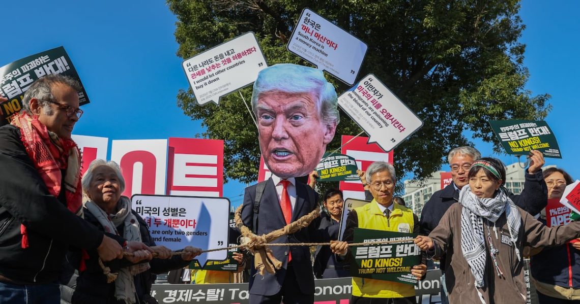 Massive Trump Face Pops Up at Protest Slamming His South Korea Visit