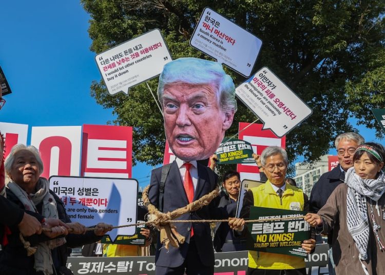 Massive Trump Face Pops Up at Protest Slamming His South Korea Visit