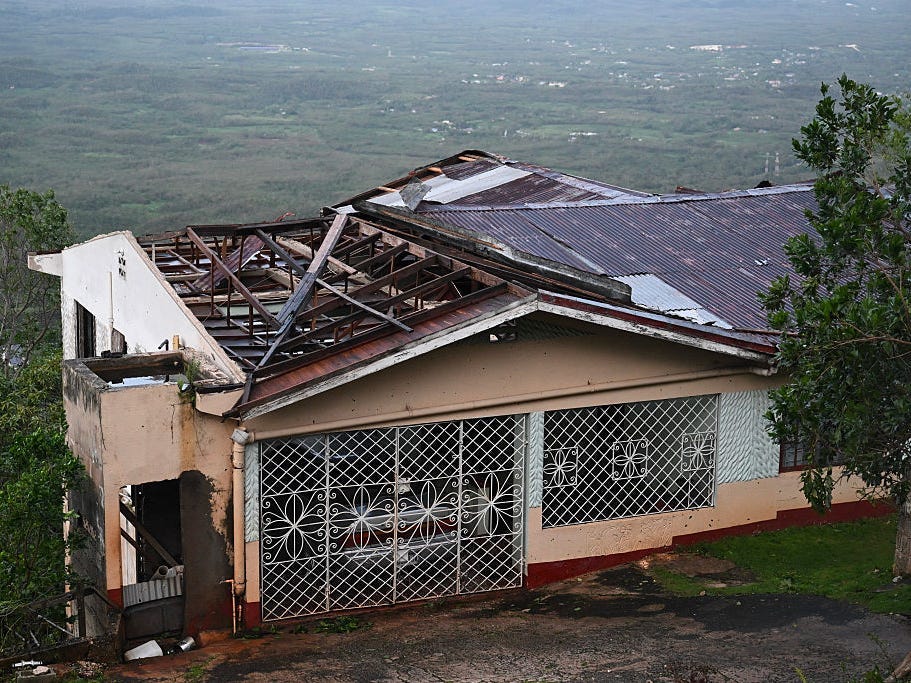 A house with a damaged roof in Manchester, Jamaica.