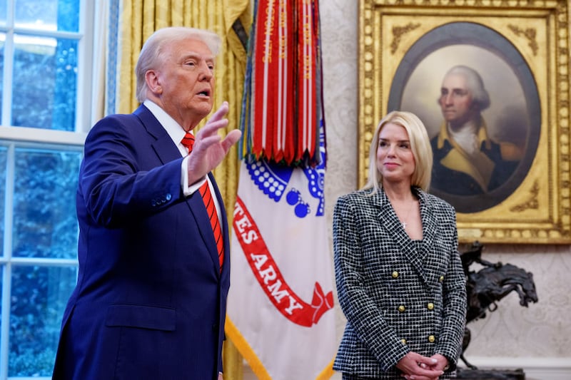 U.S. President Donald Trump, accompanied by newly sworn-in U.S. Attorney General Pam Bondi, speaks to member of the media in the Oval Office at the White House on February 05, 2025 in Washington, DC. The Senate confirmed Bondi as Attorney General with a 54-46 vote on Tuesday.
