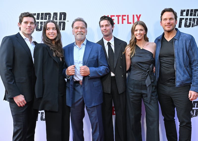Five members of the Schwarzenegger family, including Christopher, Christina, Arnold, Patrick, and Katherine, posing alongside actor Chris Pratt at the season 2 premiere of Netflix's