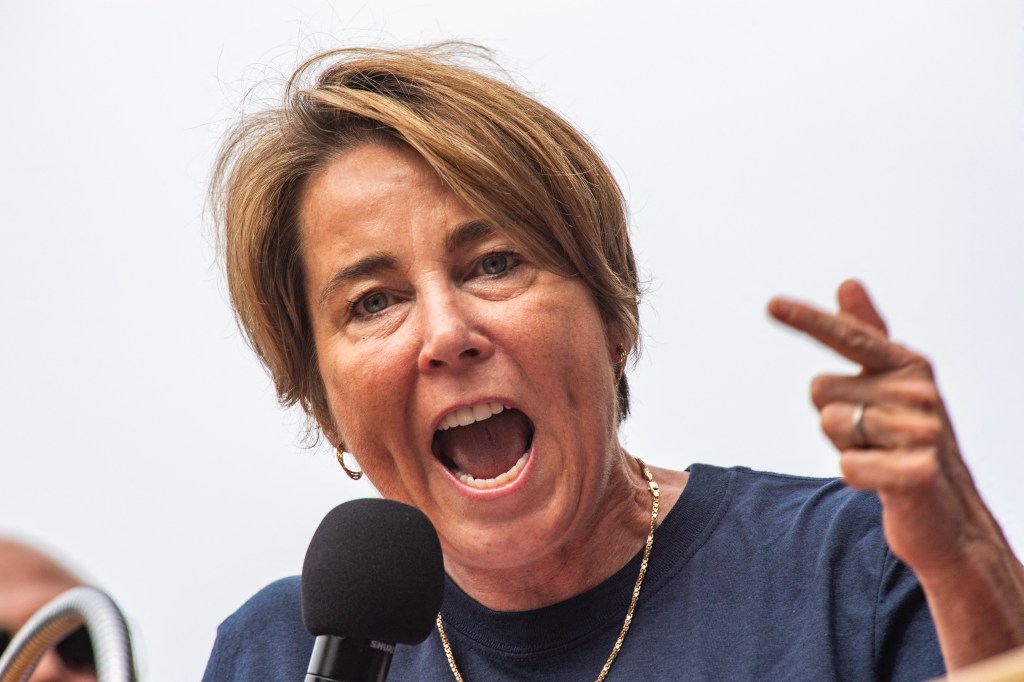 Massachusetts Governor Maura Healey addressing a crowd during a Labor Day rally.