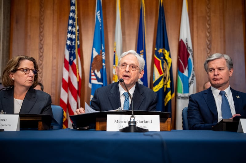 WASHINGTON, DC - MAY 13: U.S. Attorney General Merrick Garland, accompanied by Deputy Attorney General Lisa Monaco (L) and FBI Director Christopher Wray (R), speaks at an Election Threats Task Force meeting at the Justice Department on May 13, 2024 in Washington, DC. Garland, who launched the task force three years ago after a steep increase in violent threats to election workers, says, "If you threaten to harm or kill an election worker, volunteer or official, the Justice Department will find you and we will hold you accountable." (Photo by Andrew Harnik/Getty Images)