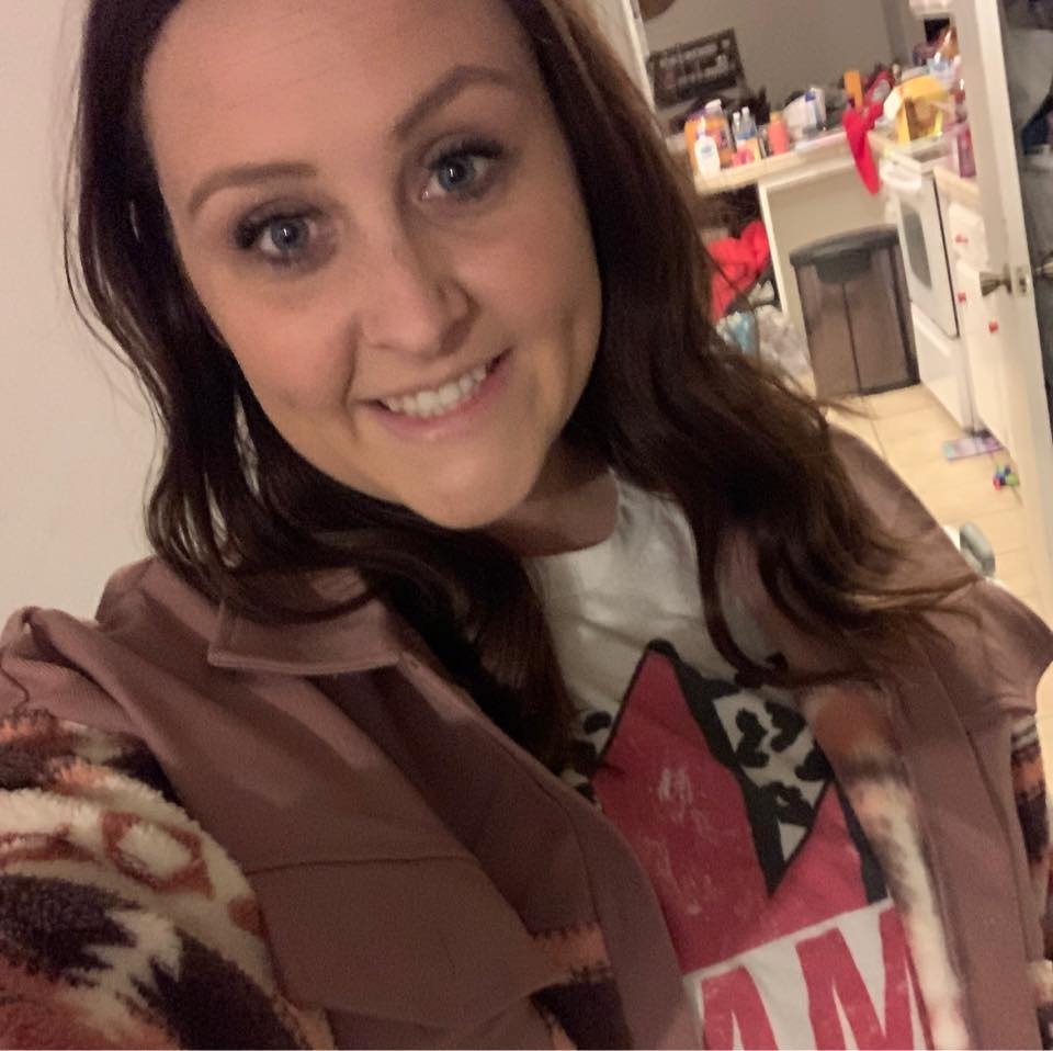 A smiling woman identified as Holly Hill, a third-grade teacher.