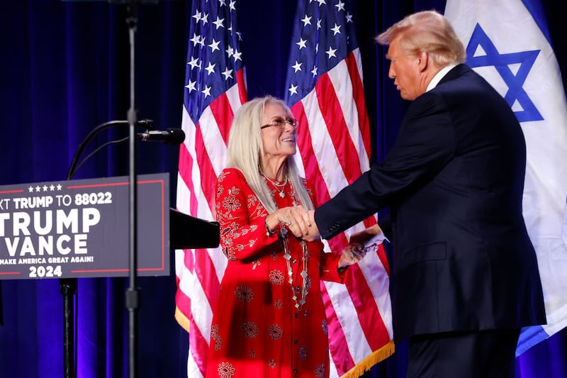 Miriam Adelson, widow of billionaire casino magnate Sheldon Adelson, welcomes Republican presidential nominee, former U.S. President Donald Trump to the stage to speak before prominent Jewish donors at an event titled  "Fighting Anti-Semitism in America" at the Hyatt Regency Capitol Hill on September 19, 2024 in Washington, DC.