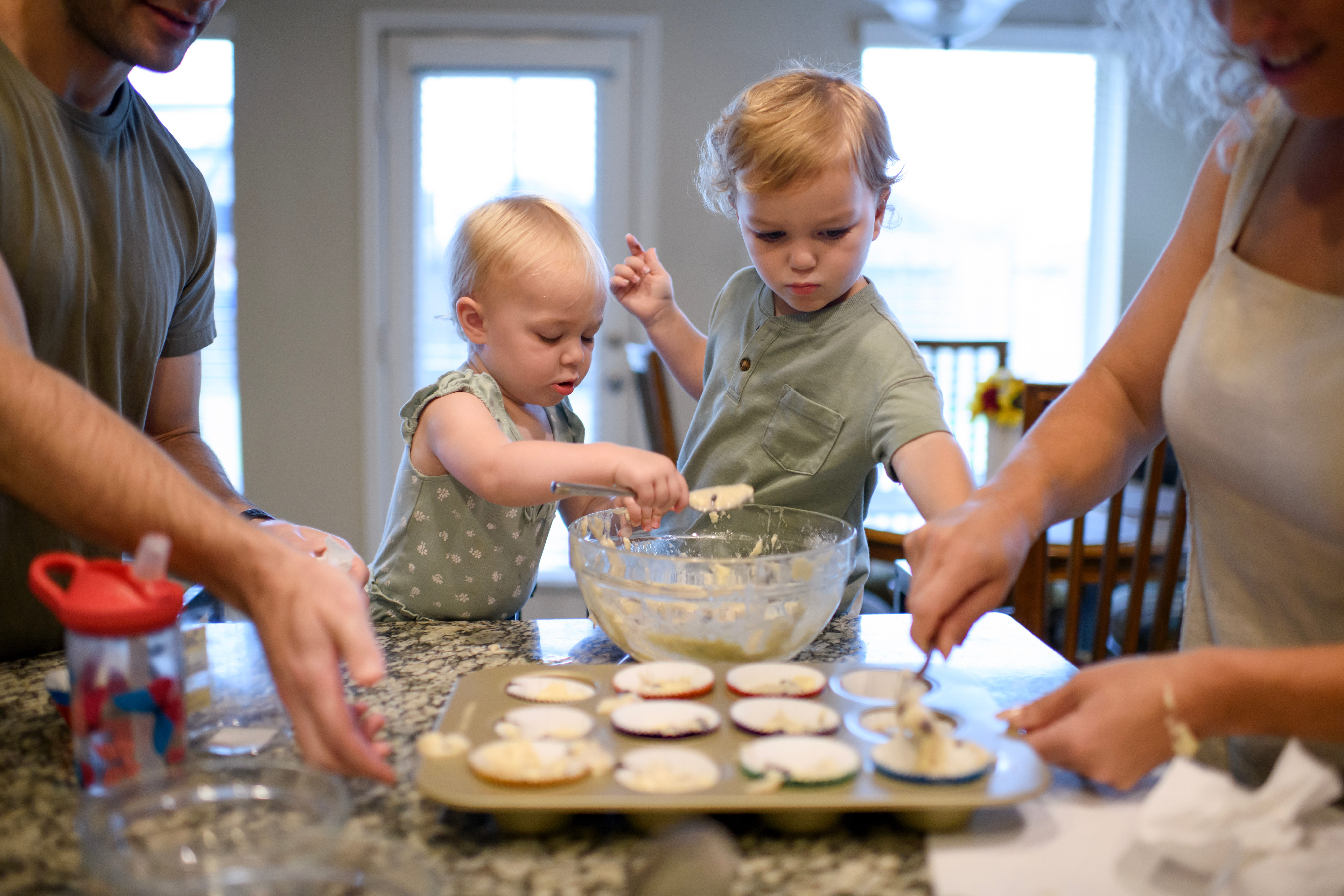 Erin Rost making muffins with her kids.