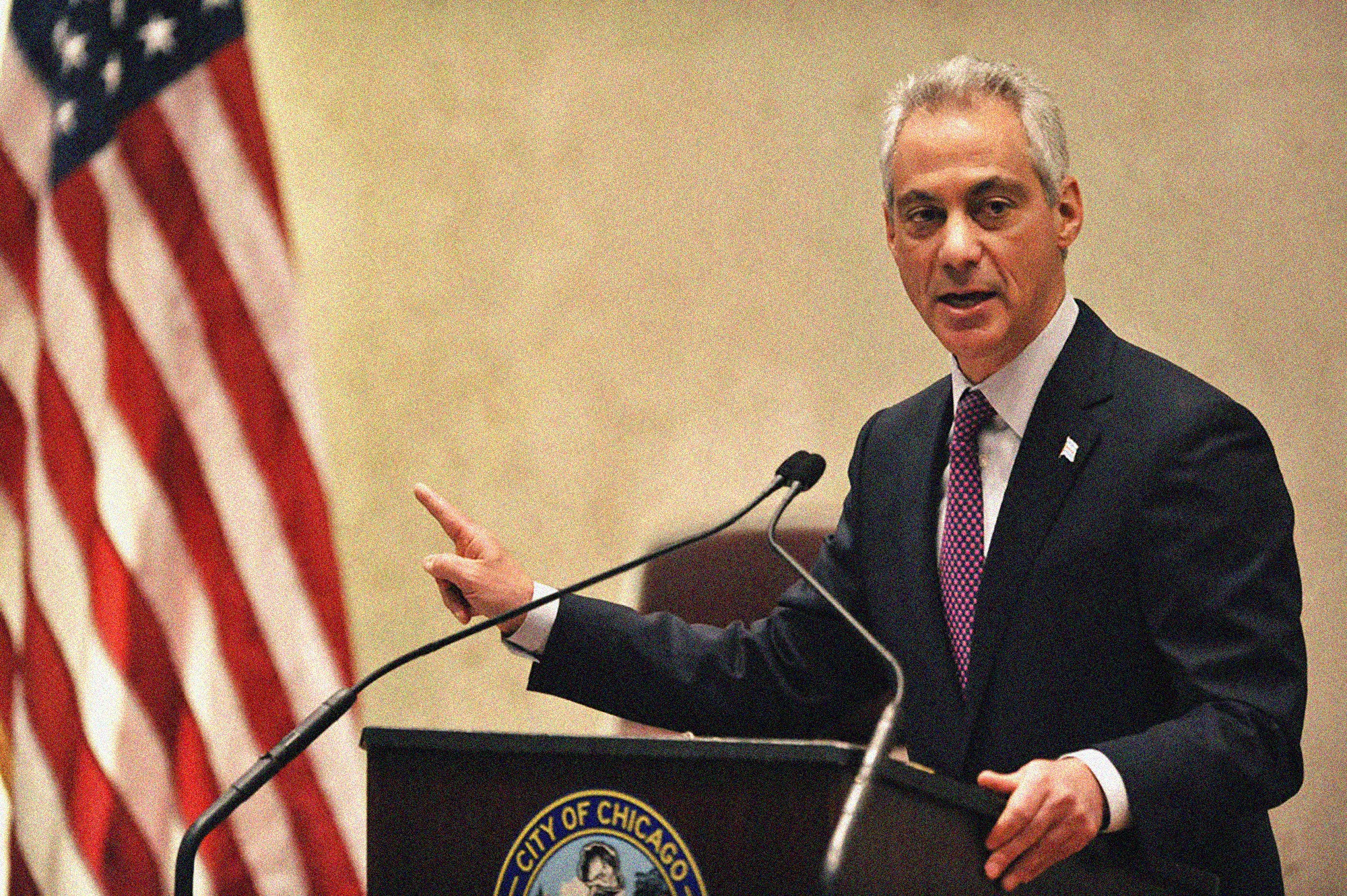 Rahm Emanuel standing at a podium speaking.