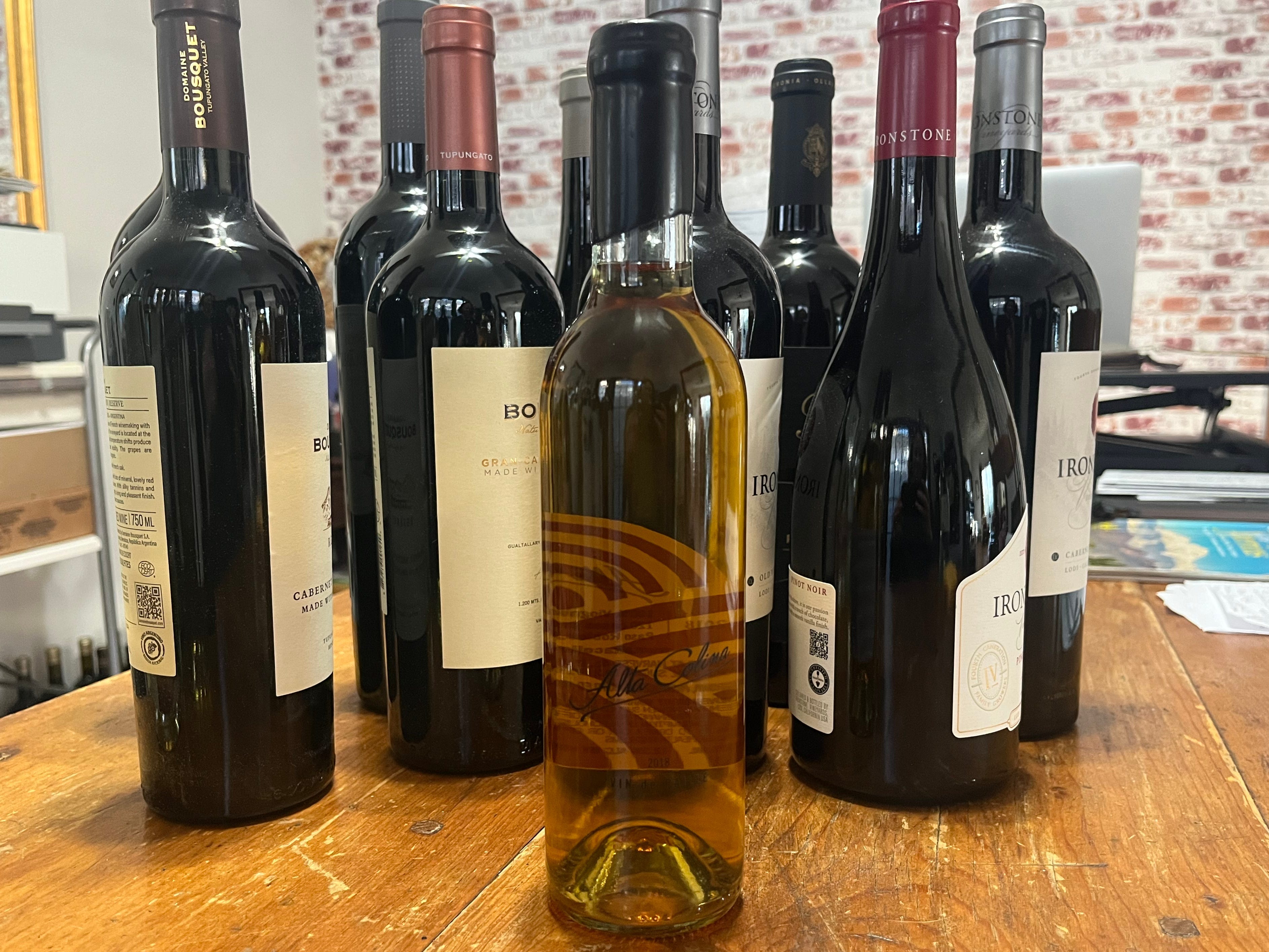 bottle of sweet wine in front of other bottles of wine