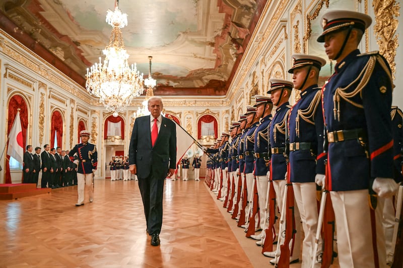 President Donald Trump reviews an honour guard composed of members of the Japan Self-Defense Force at the Akasaka State Guest House in Tokyo on October 28, 2025.