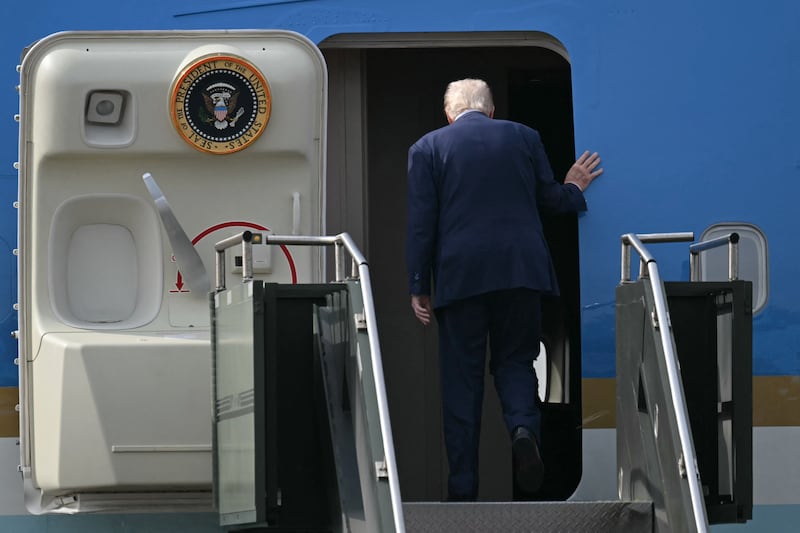 U.S. President Donald Trump boards Air Force One after talks with China's President Xi Jinping at the Gimhae Air Base in Busan, South Korea on October 30, 2025.