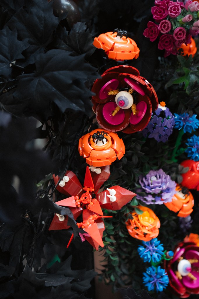 Lego Halloween decorations featuring spiders and an eyeball on a stoop.