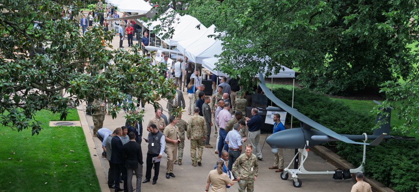 Pentagon employees view unmanned aerial and ground system prototypes during the Rapid Prototype Display event at the Pentagon Center Courtyard, Arlington, Va., July 16, 2025.