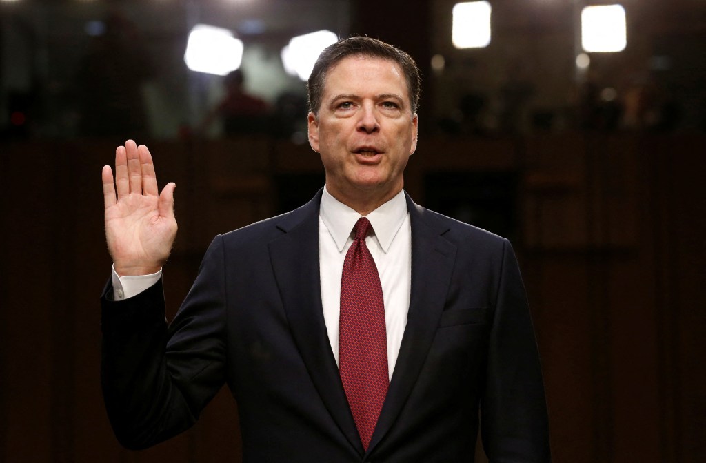 Former FBI Director James Comey sworn in while testifying before a Senate Intelligence Committee.