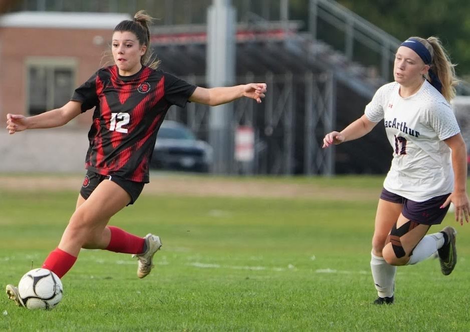 Jadyn Stadler of the Syosset girls soccer team works the ball upfield during a recent game.