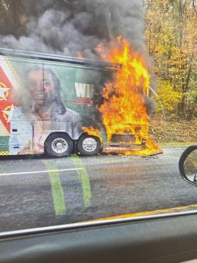 A fire burns the back of Virginia Lt. Gov. Winsome Earle-Sears' campaign bus on Route 33 on Oct. 30, 2025.