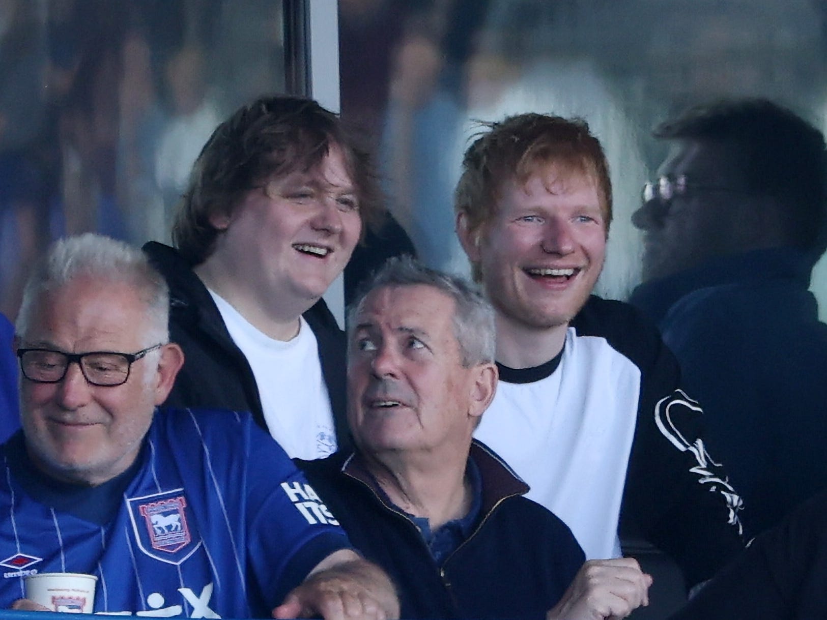 Singer-Songwriter Lewis Capaldi and British Singer-Songwriter Ed Sheeran look on from the stands prior to the Premier League match