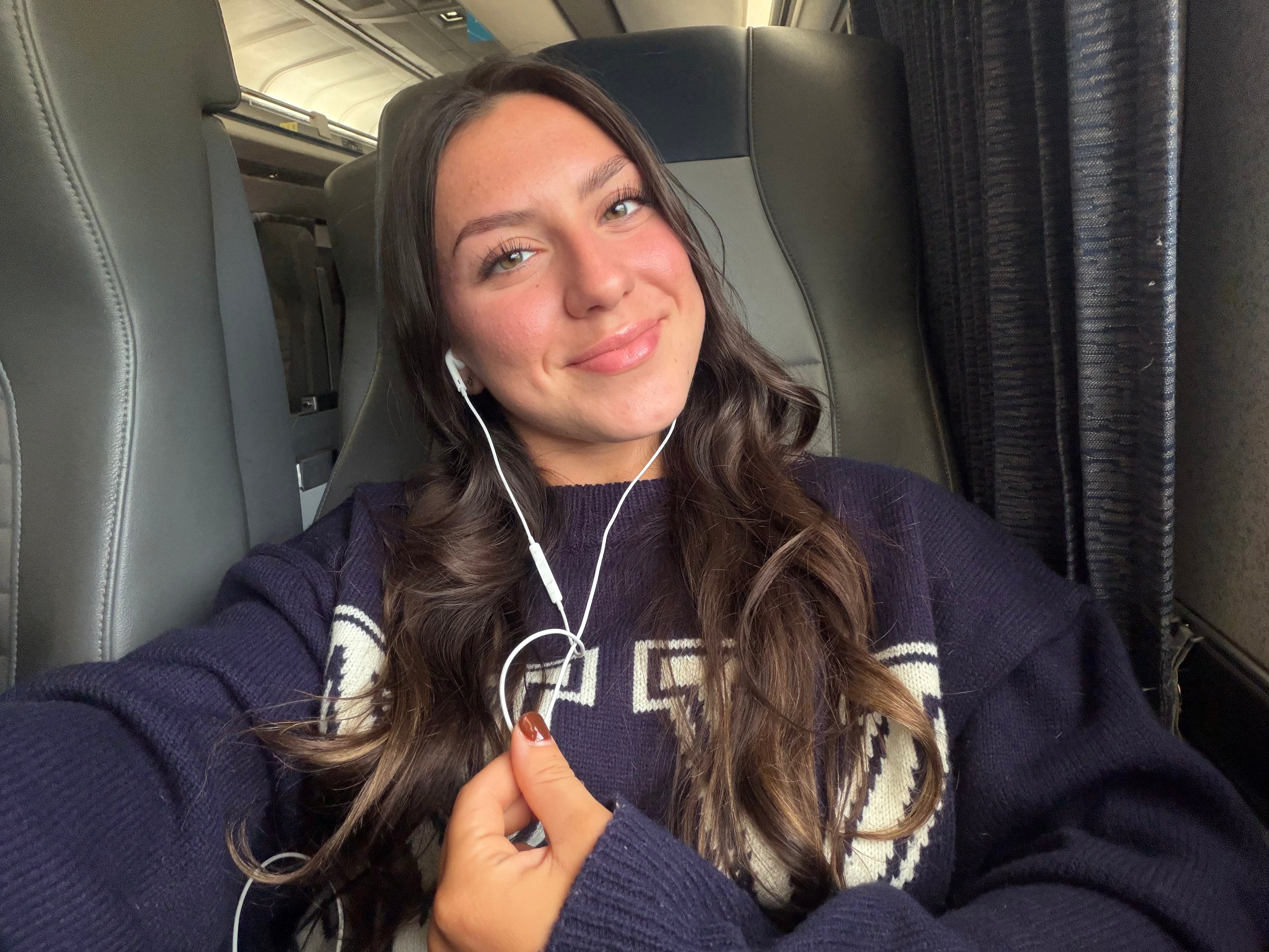 Amanda taking a selfie in her Amtrak seat.