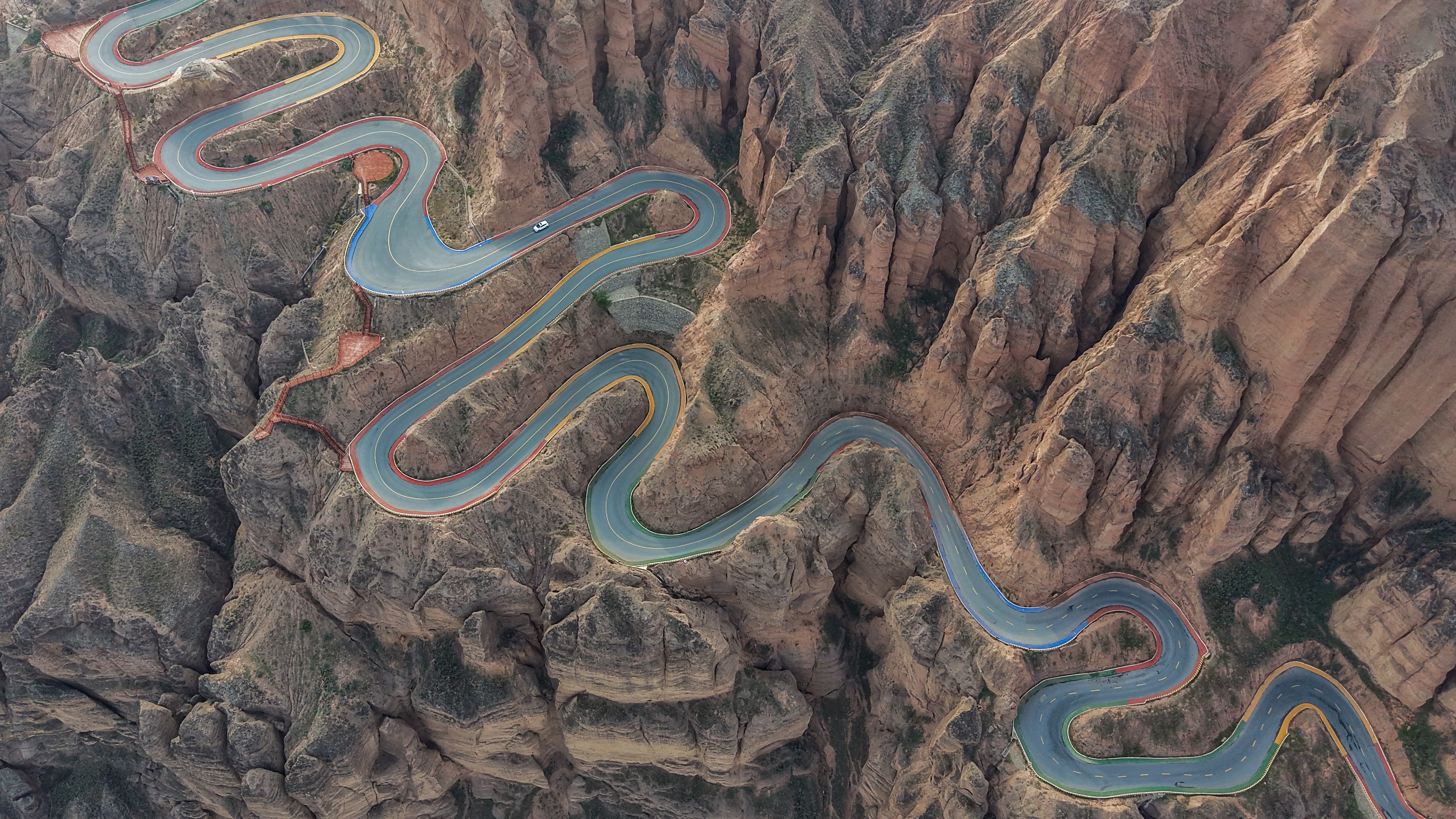 An aerial view of a very twisty mountain road