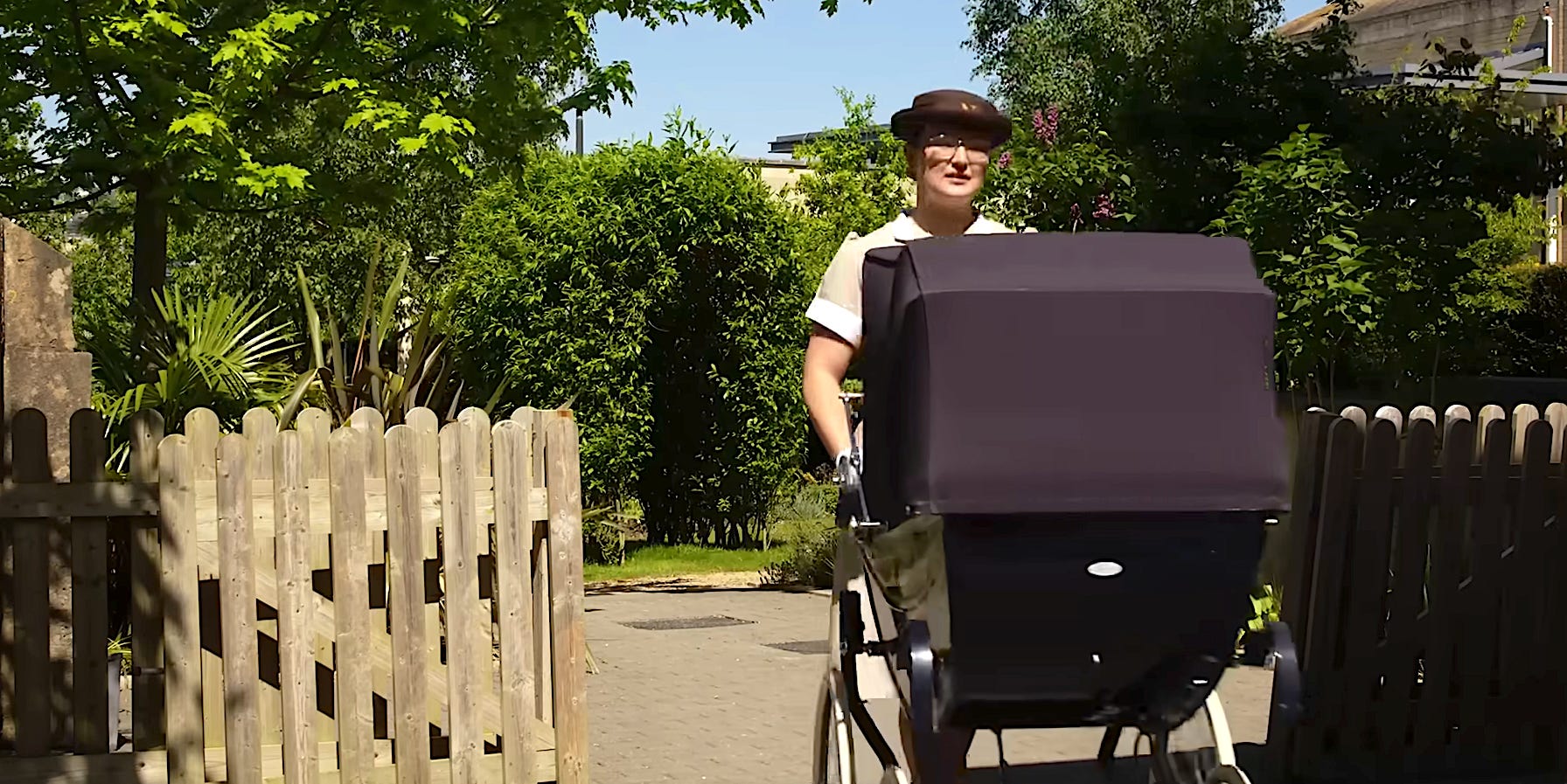 woman pushing baby stroller
