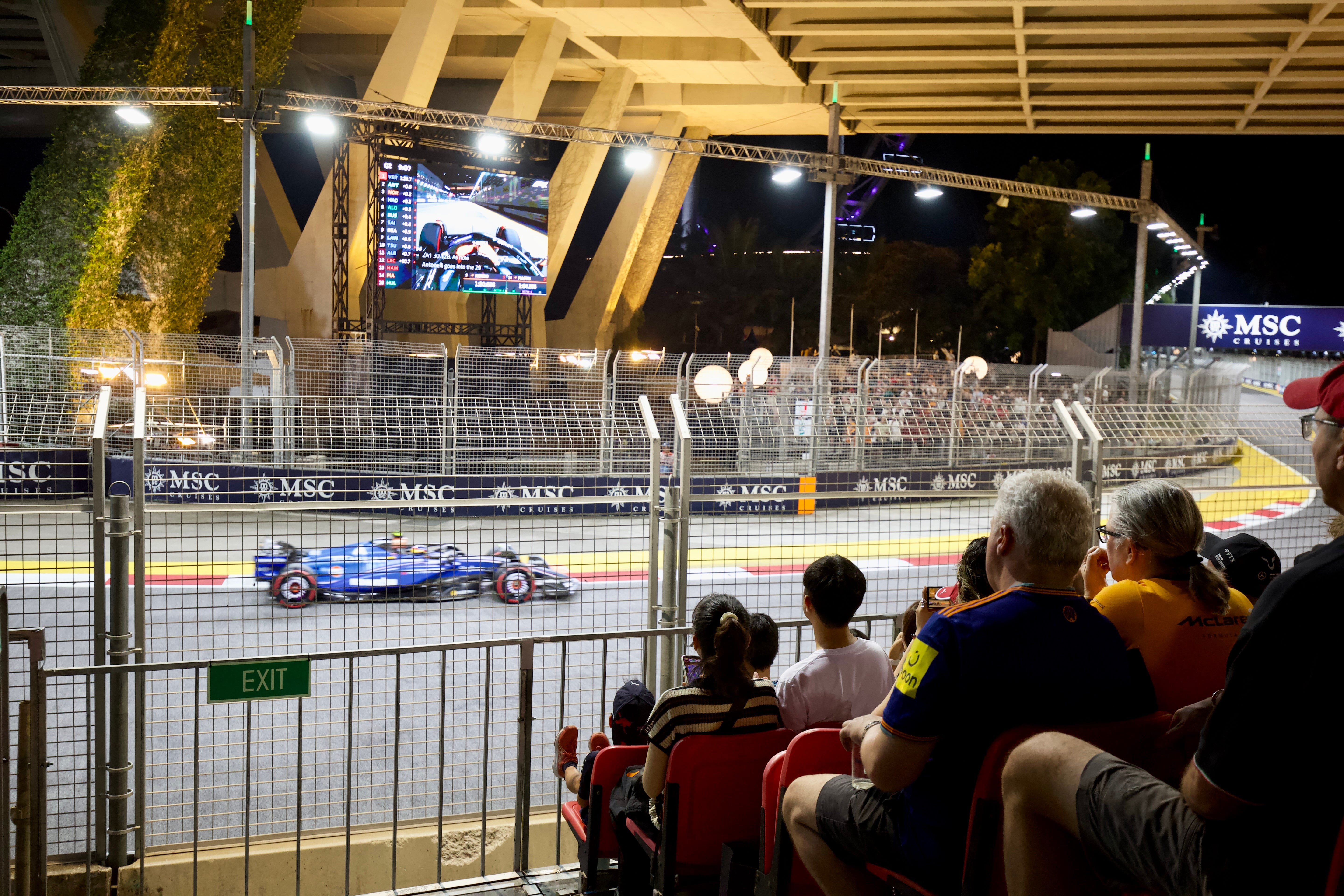 A view of a racecar from one of the many F1 stands.