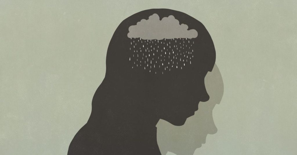 ​A silhouette of a sad person