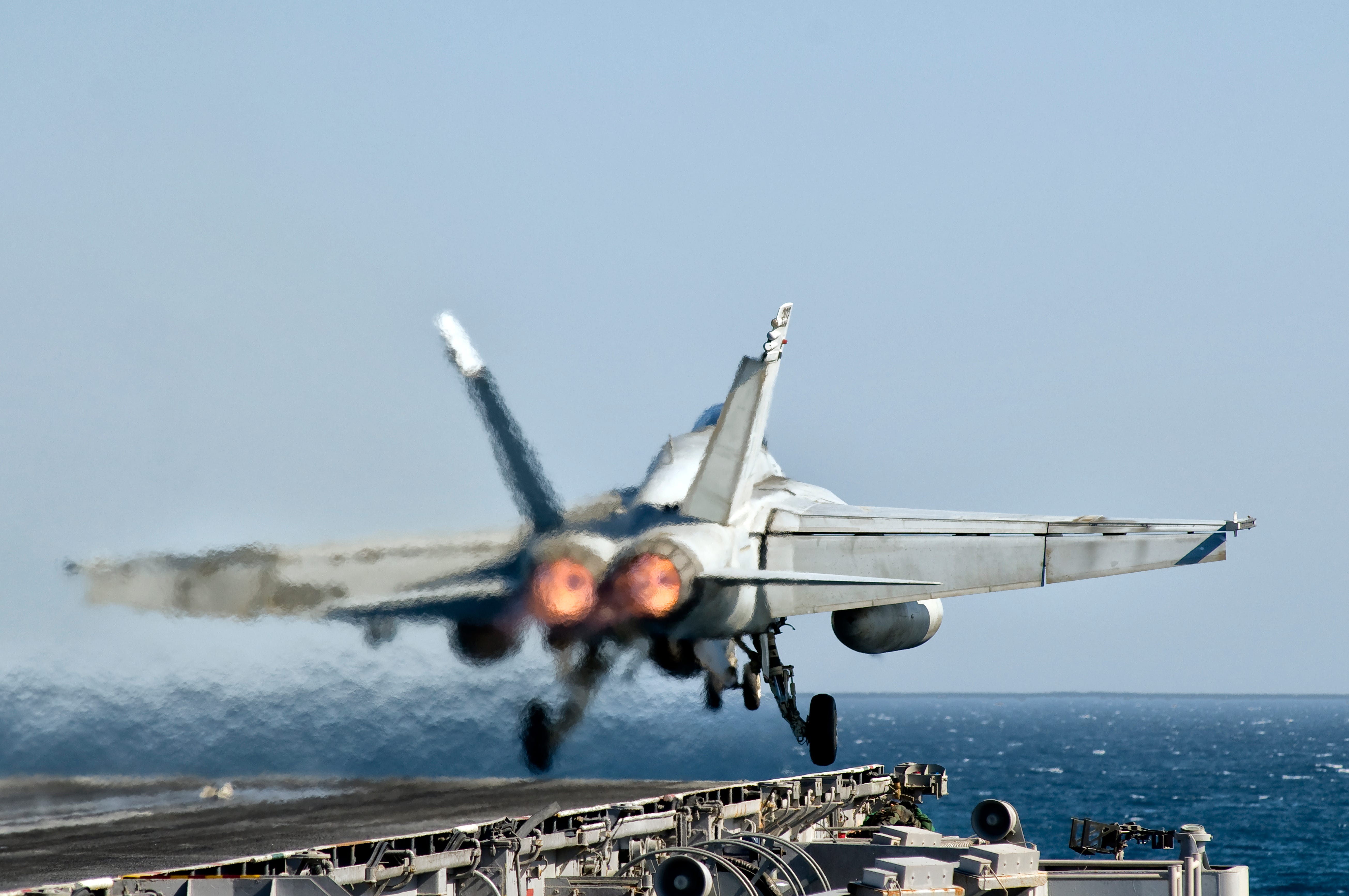 An F/A-18 Super Hornet takes off from a Nimitz aircraft carrier.