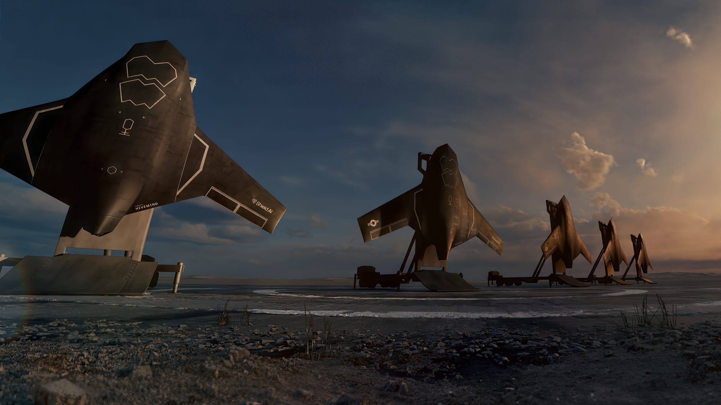 Five large black aircraft sitting up on their tails outdoors