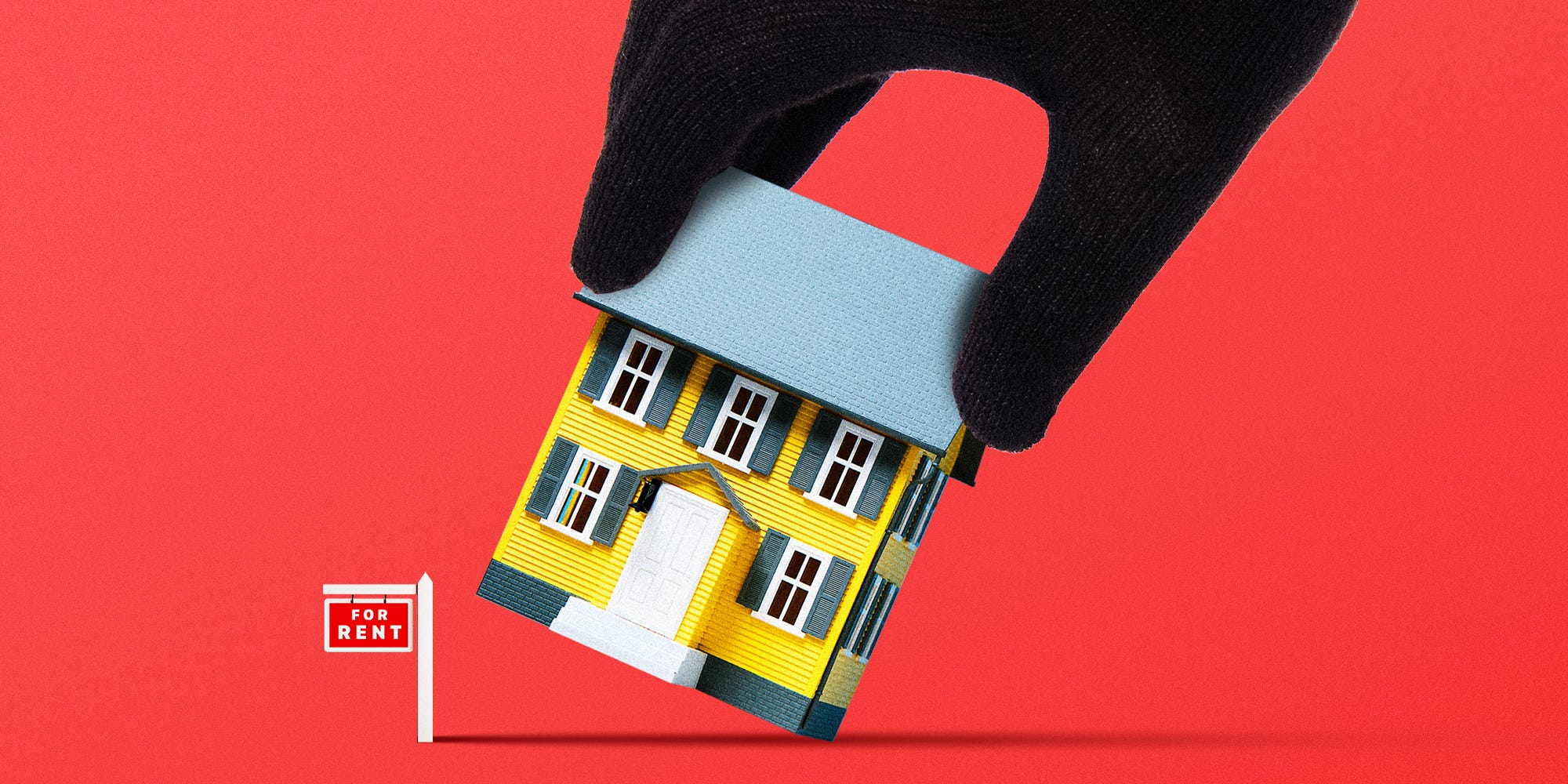 A burglar's hand picking up a house that has a 