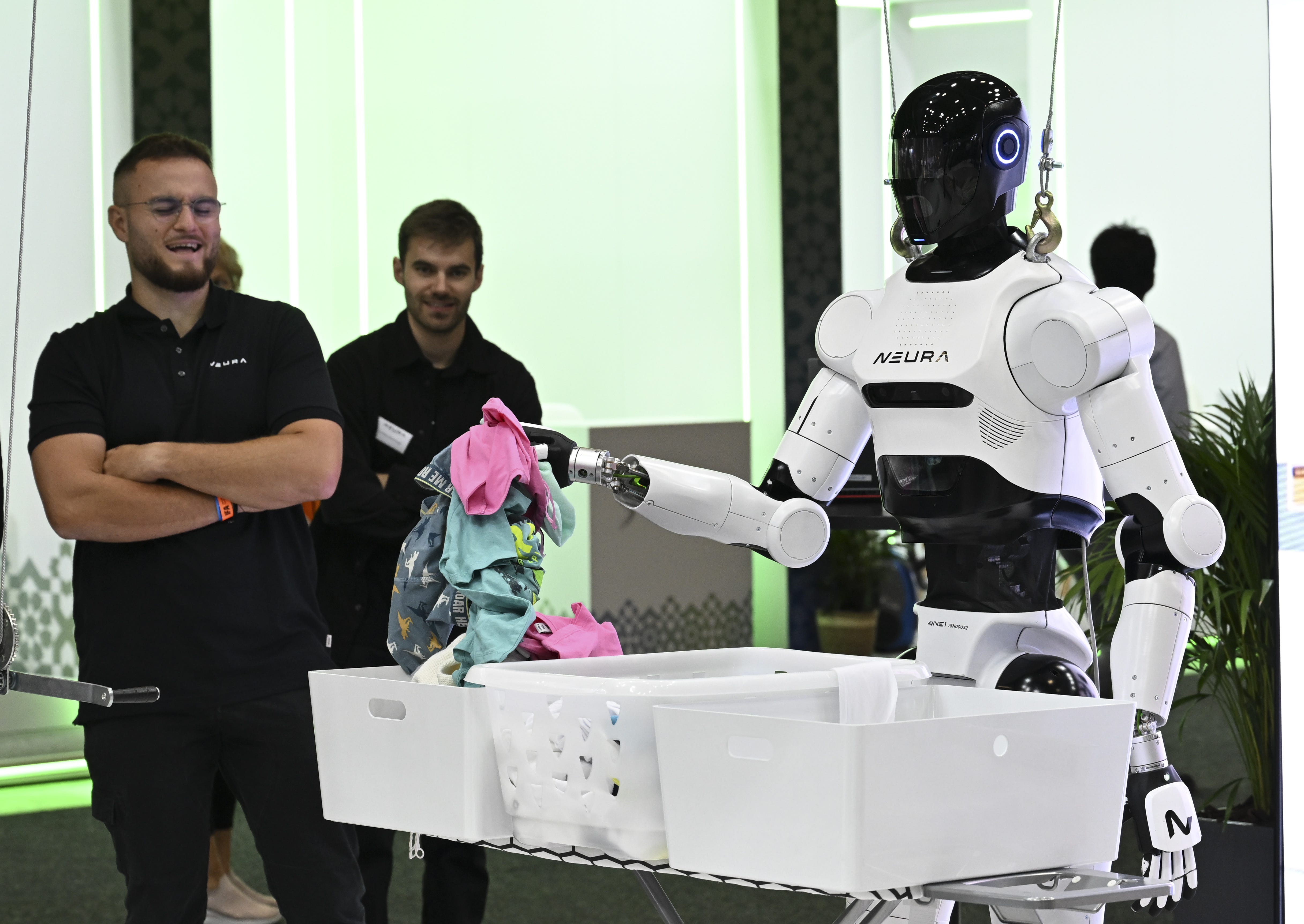 A humanoid robot folding laundry.