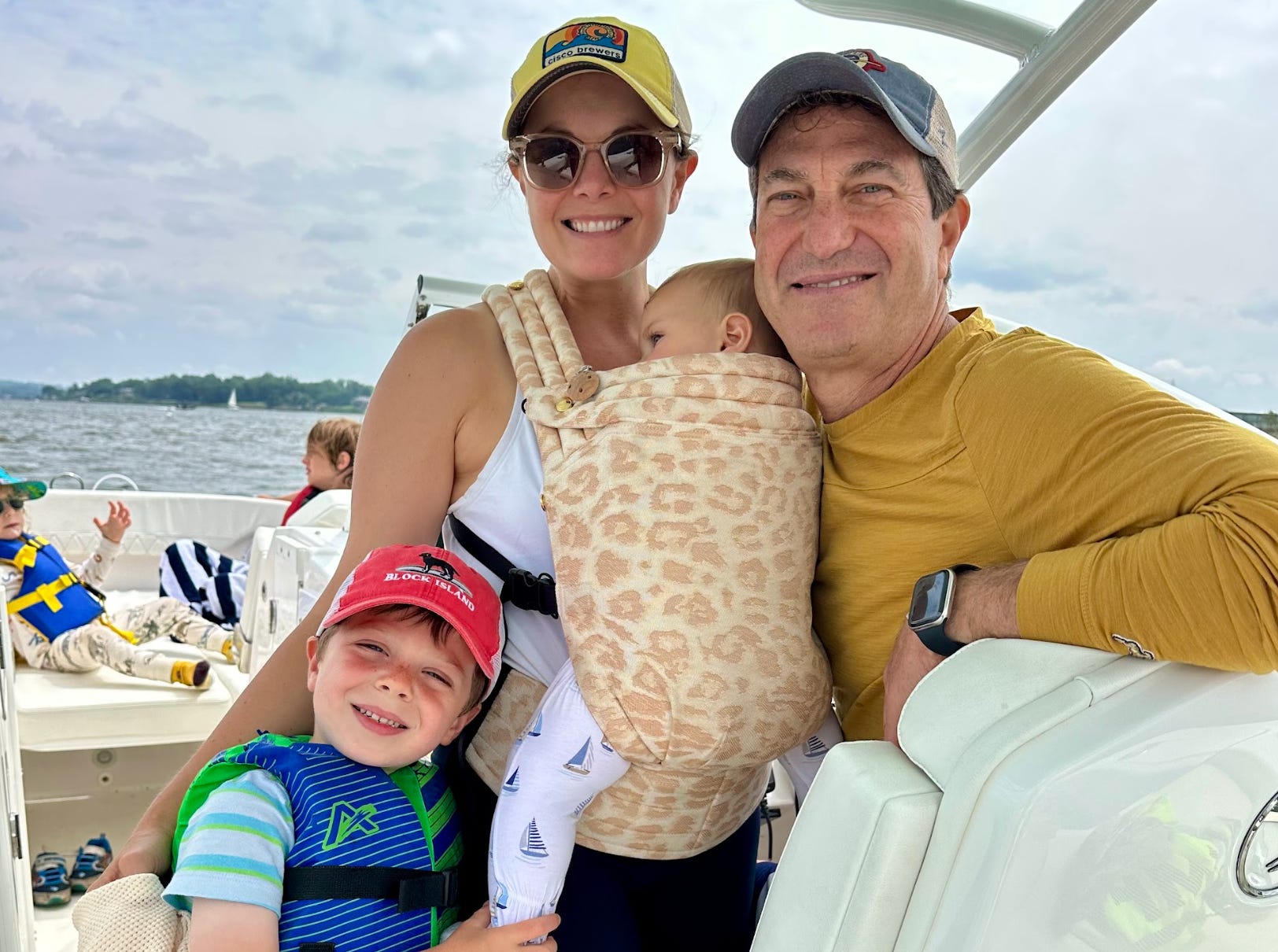 The writer, her partner, and her kids on a boat in New York.