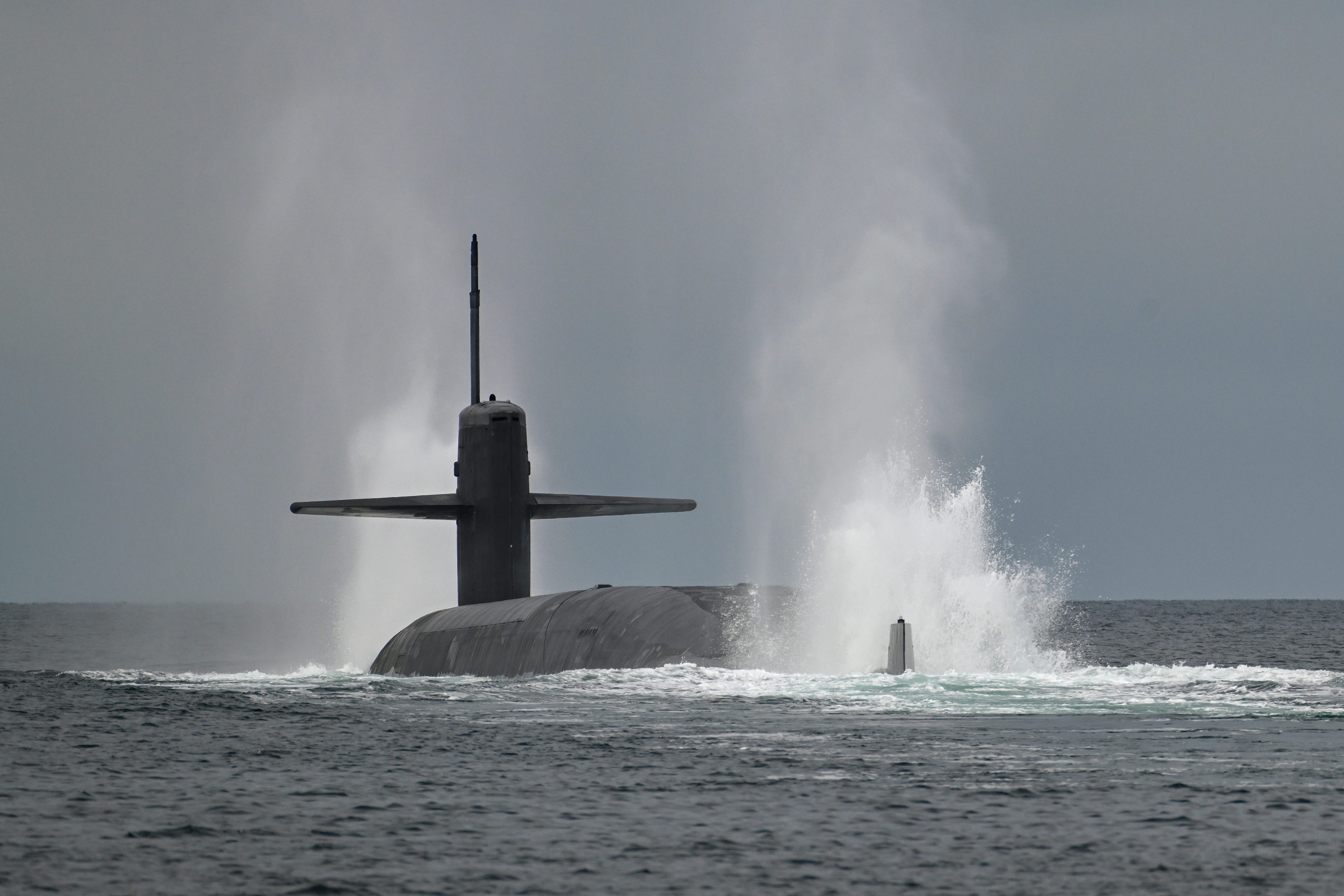 The Ohio-class ballistic-missile submarine USS Maine (SSBN 741) begins a dive into the Strait of Juan de Fuca off the Washington Coast, March 18, 2025.