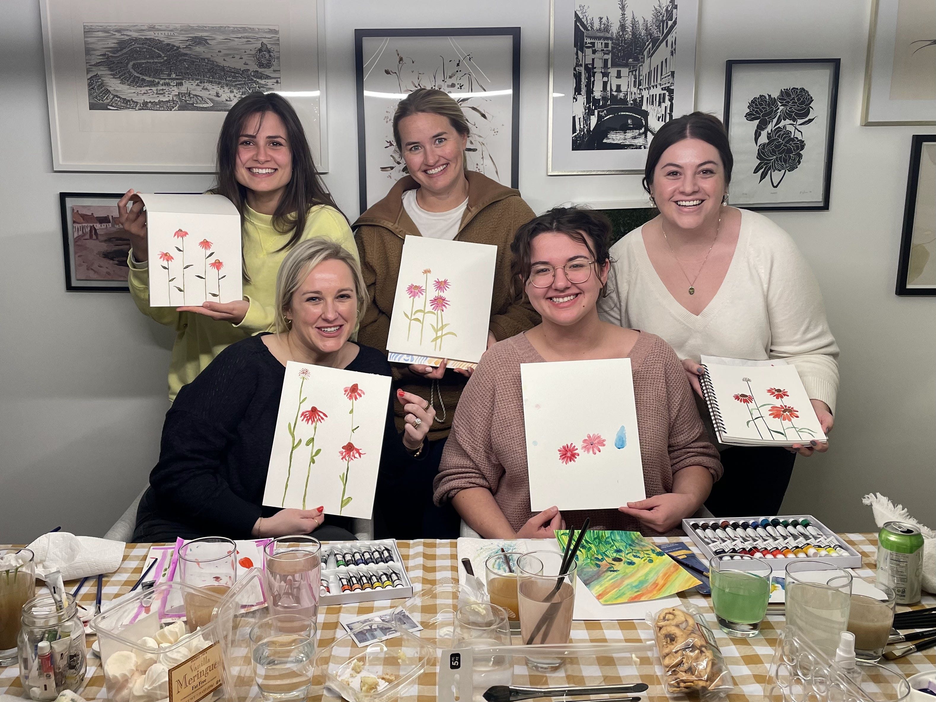 The author with four friends showing off watercolors they'd created in their watercolor club.
