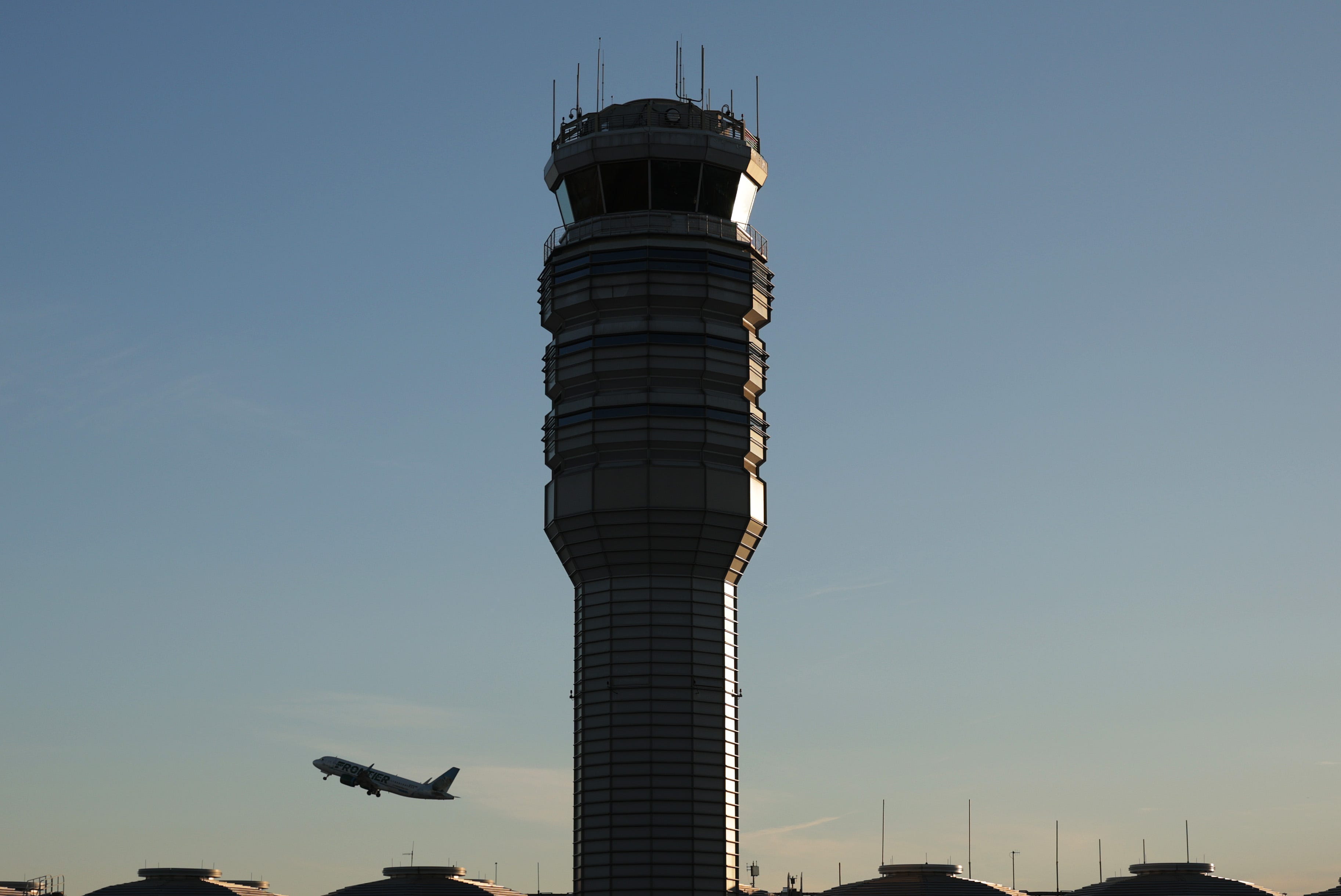 The control tower stands at Ronald Reagan Washington National Airport as a plane takes off in Arlington, Virginia.