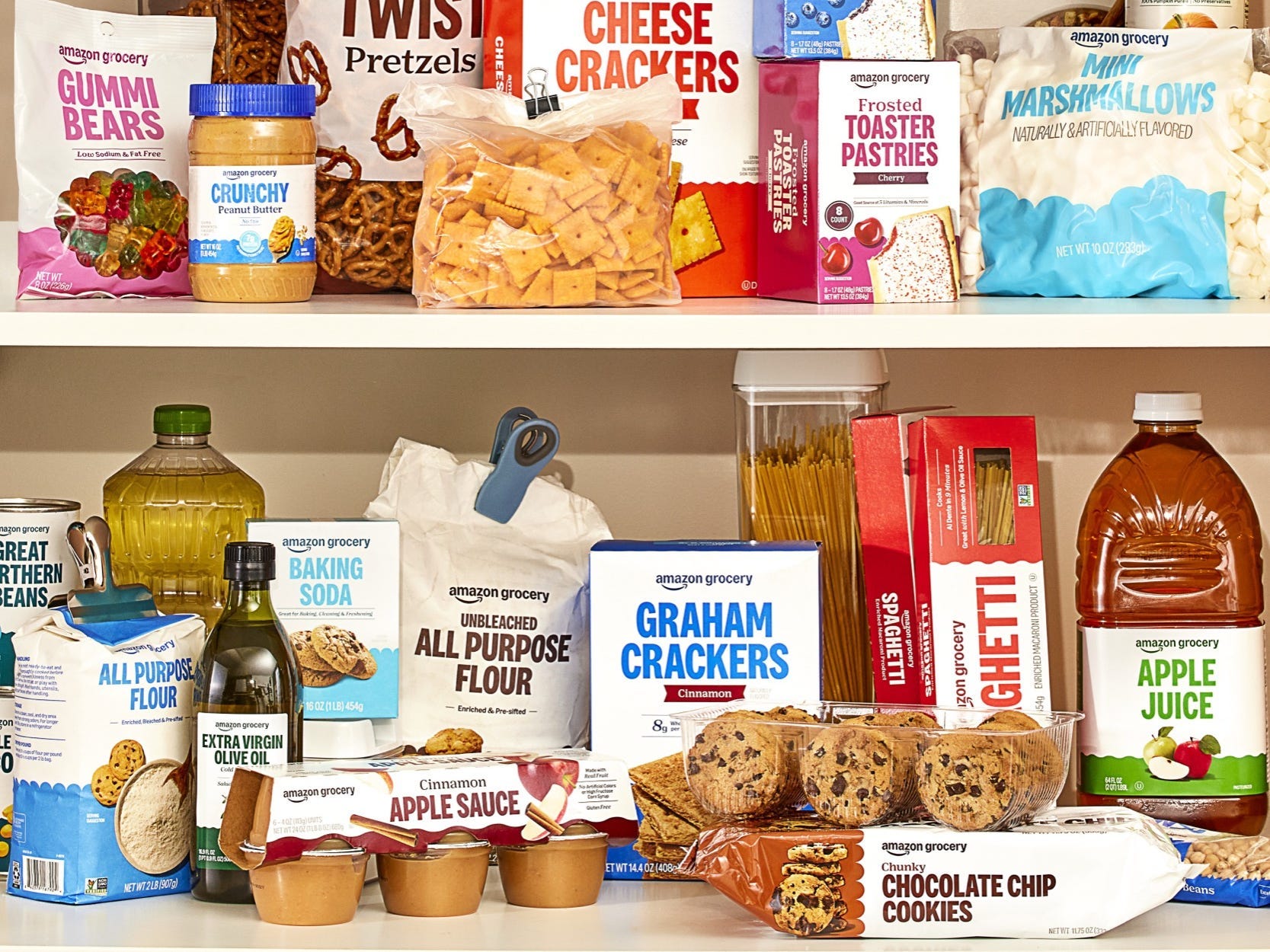 Shelves stocked with Amazon Grocery products.