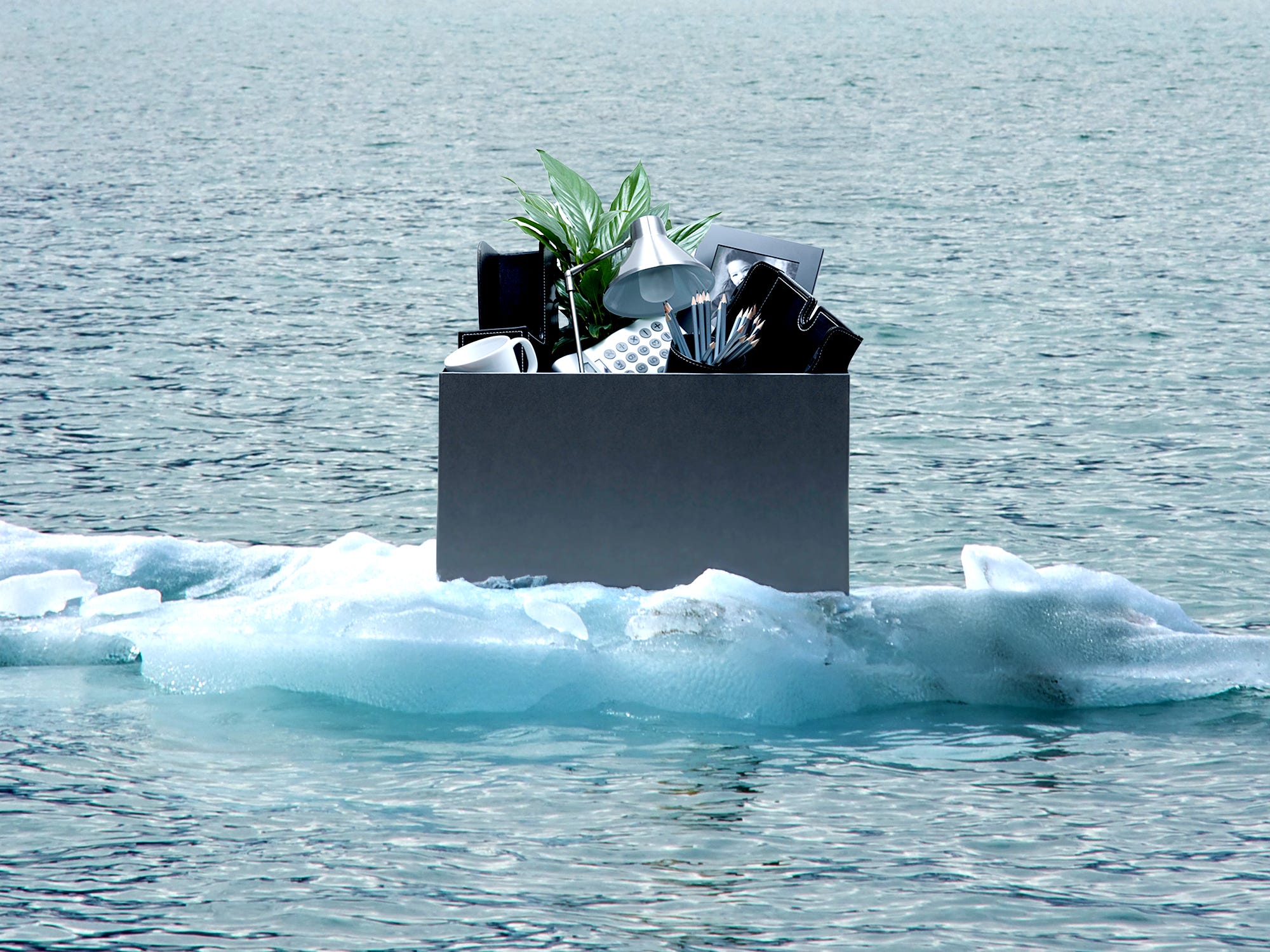 A box of office supplies in an iceberg.