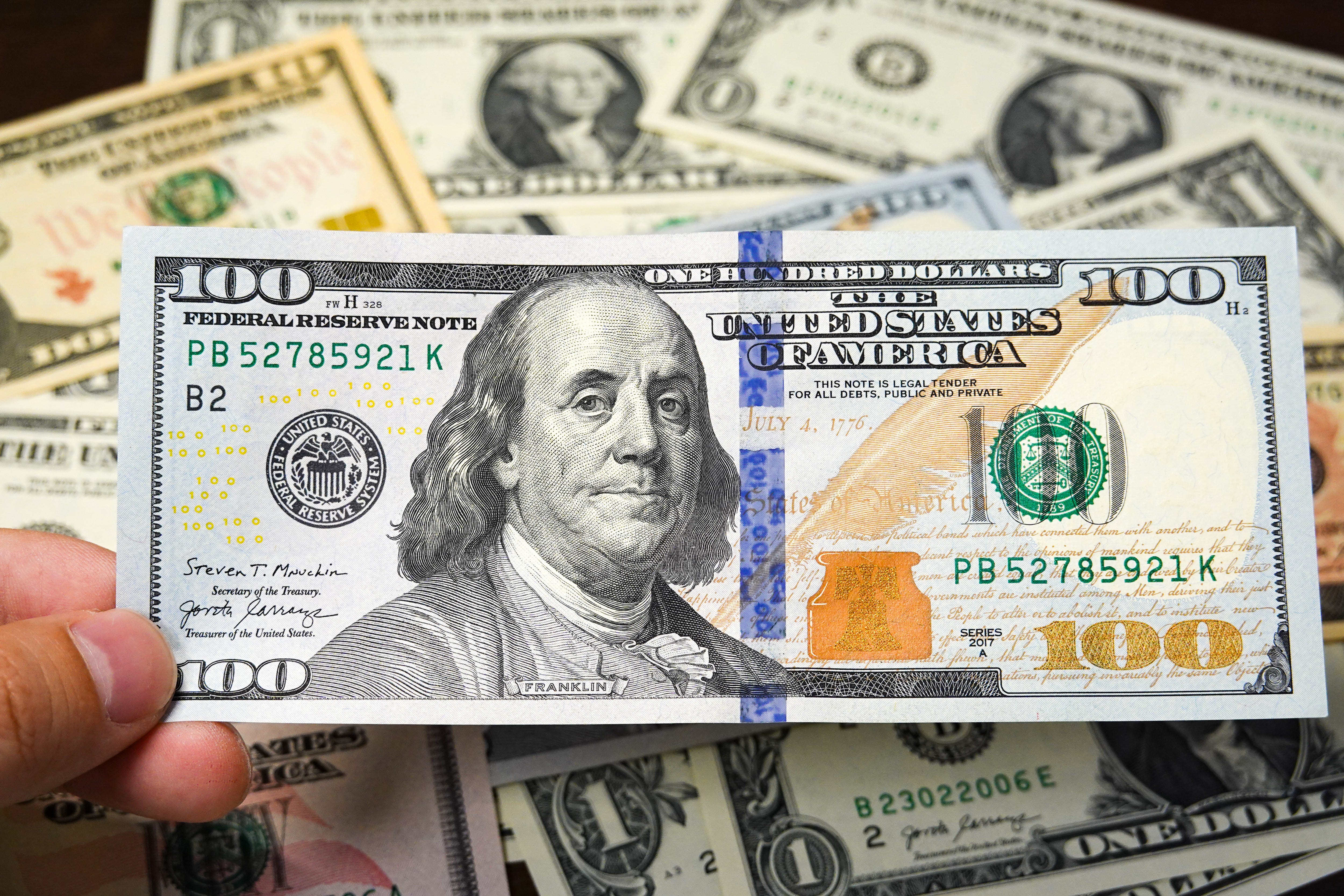 A $100 Federal Reserve Note with Benjamin Franklin's portrait on it.