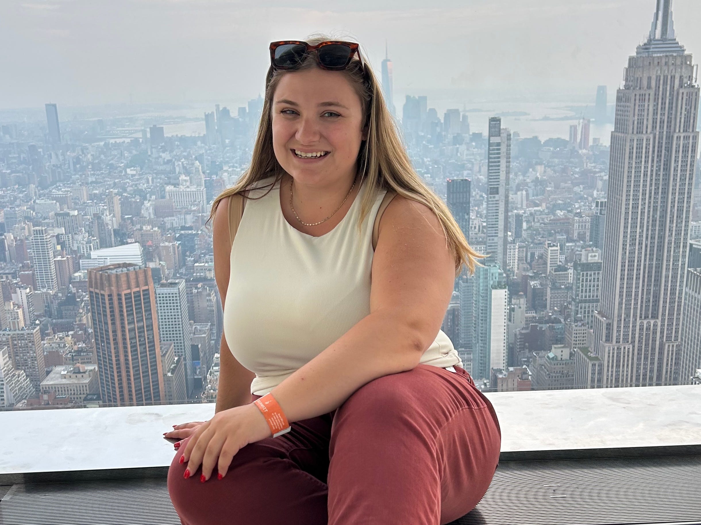Woman posing with New York City view
