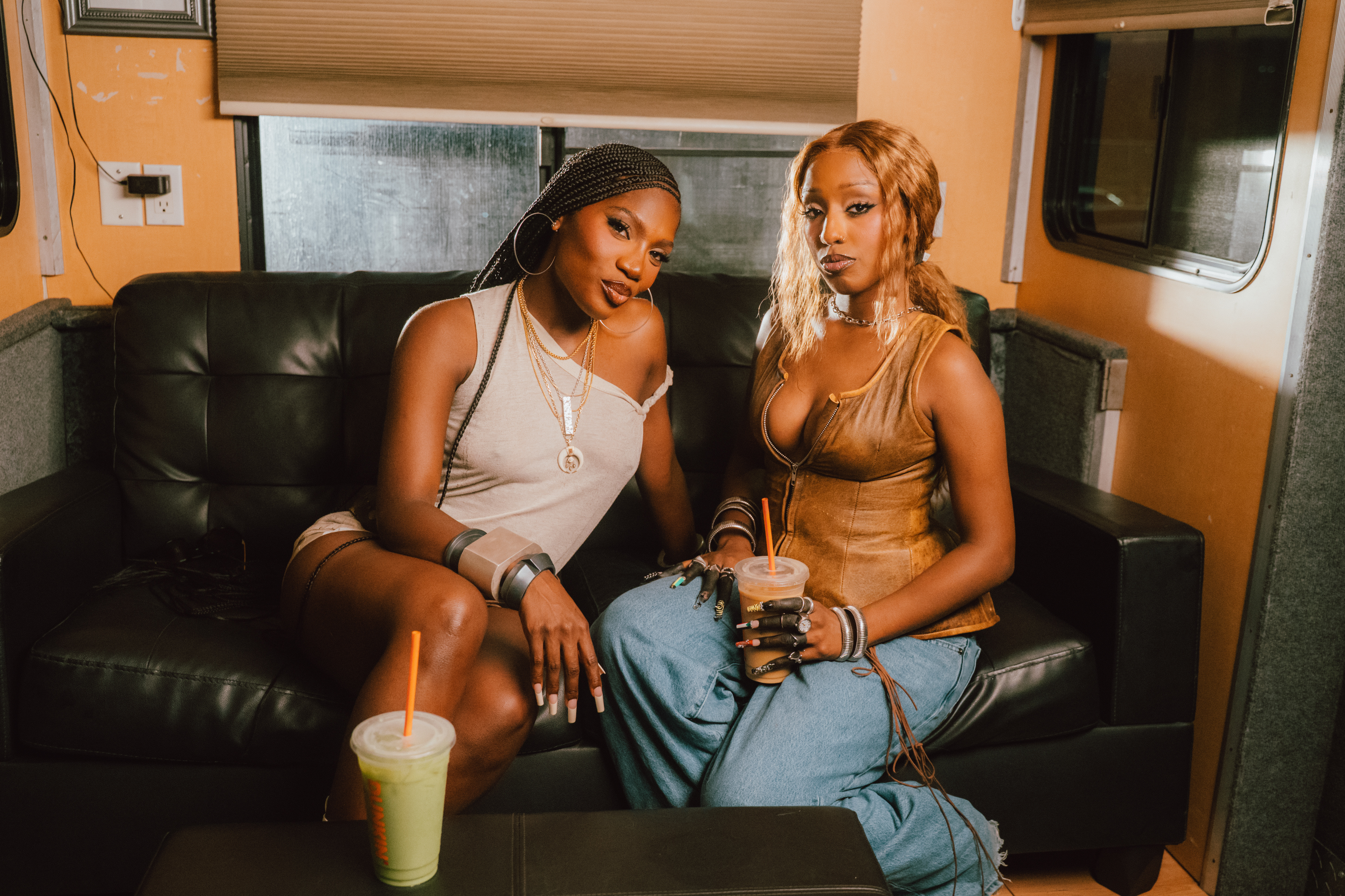 Doechii and Alemeda take a Dunkin’ iced coffee and “swamp water” (matcha) break while filming the music video for their new single.