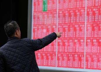 Asian shares are mixed as region watches for outcome from Trump’s visits