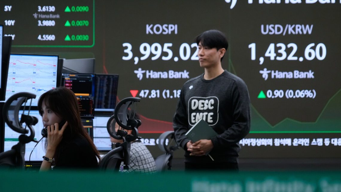 Asian shares mostly fall as region watches for outcome from Trump’s visits