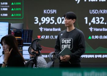 Asian shares mostly fall as region watches for outcome from Trump’s visits